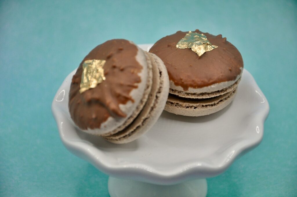 a white plate topped with chocolate covered cookies