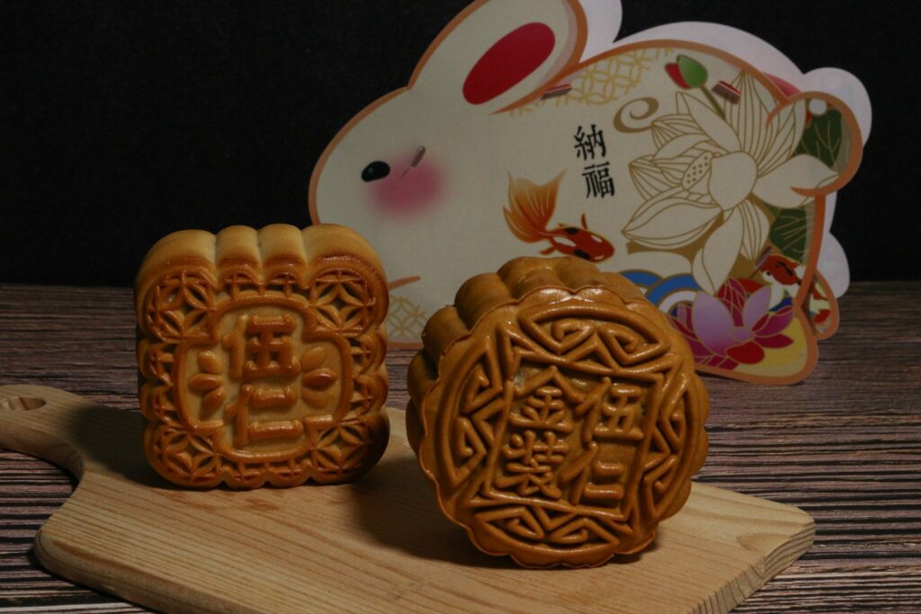 A couple of cookies sitting on top of a wooden cutting board