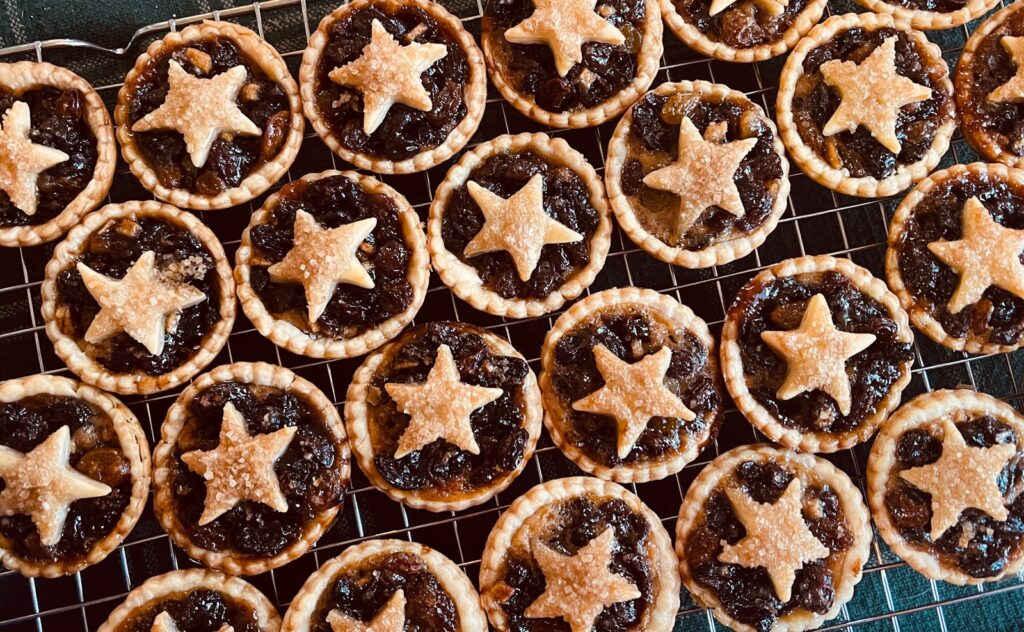 A cooling rack filled with star shaped pastries
