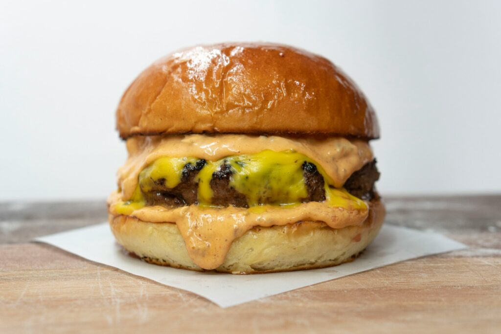 burger on brown wooden table
