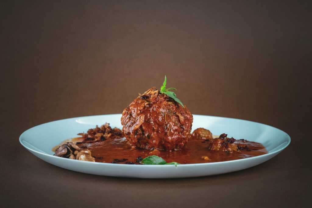 cooked meat on white ceramic plate