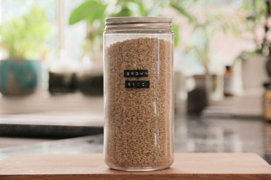 a jar filled with sand sitting on top of a table