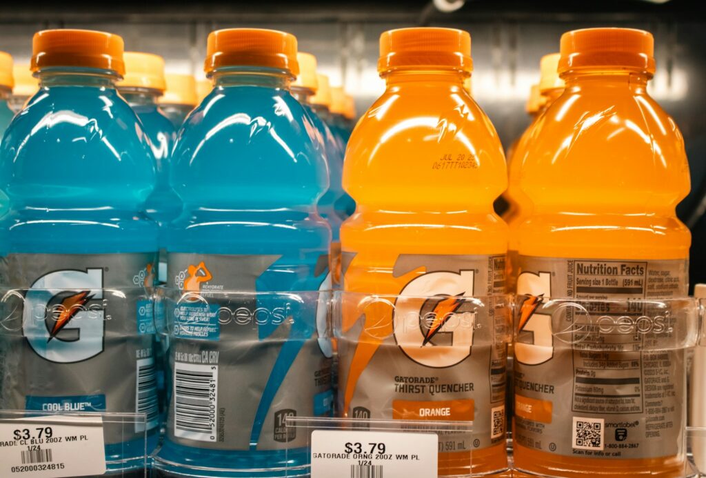 Gatorade bottles are shown on a shelf.