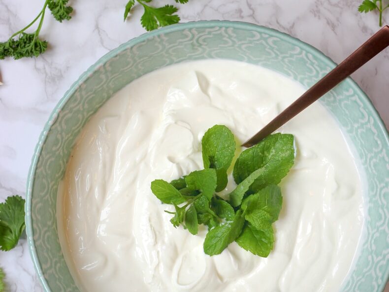 a bowl of yogurt with a spoon in it