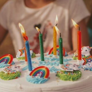 unicorn rainbow Birthday cake with five assorted-color candles