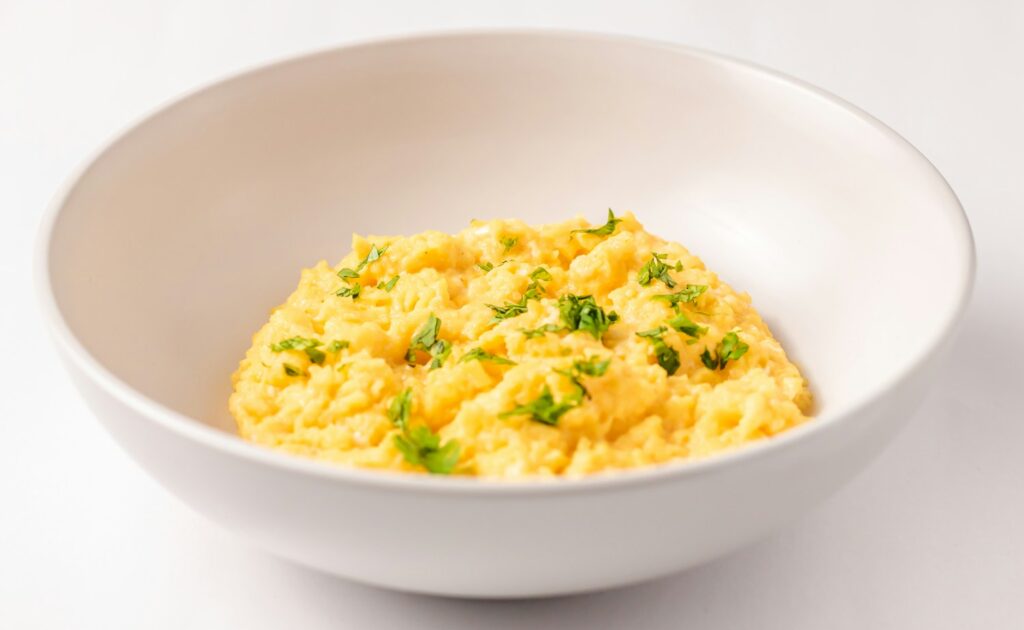 a close up of a bowl of food on a table
