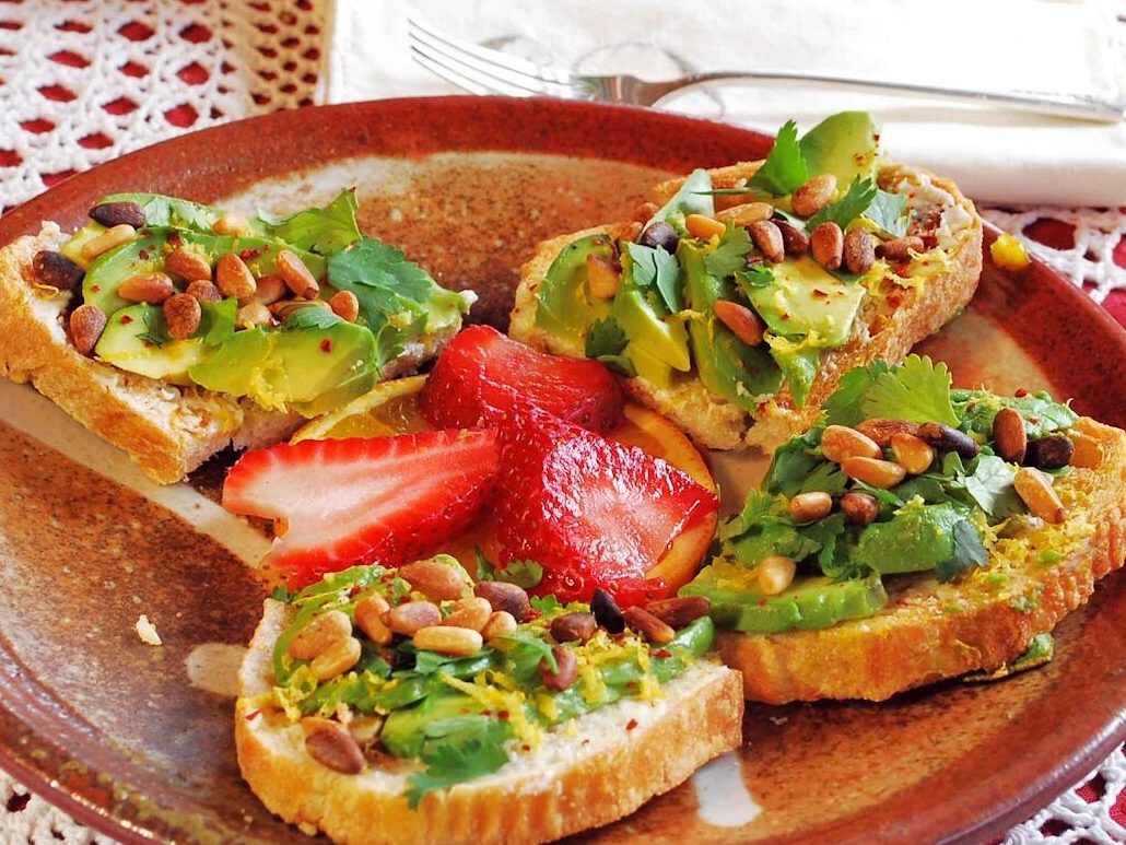 baked bread with sliced fruits on brown plate
