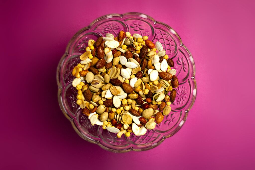 brown and white nuts on clear glass bowl