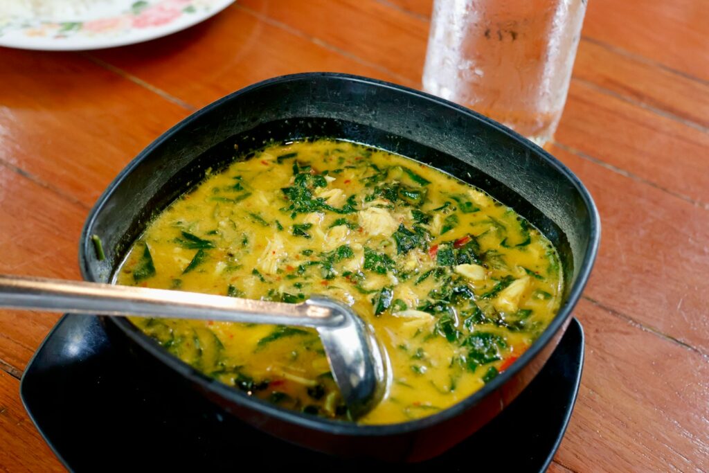a bowl of soup with a spoon in it