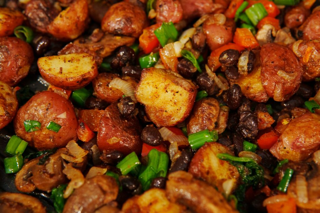 A close up of a plate of food with meat and vegetables